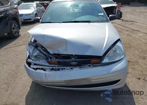 2001 Ford Focus Lx z USA, uszkodzony, nr VIN 1FAFP33P61W315115